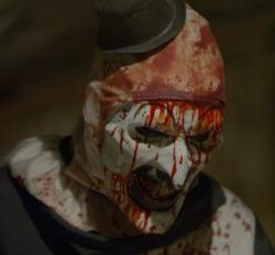 Screen capture showing mutilated clown character from: Terrified, a film in the horror genre