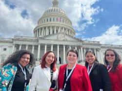 photo of students and faculty standing in front of Capitol Building in Washington DC